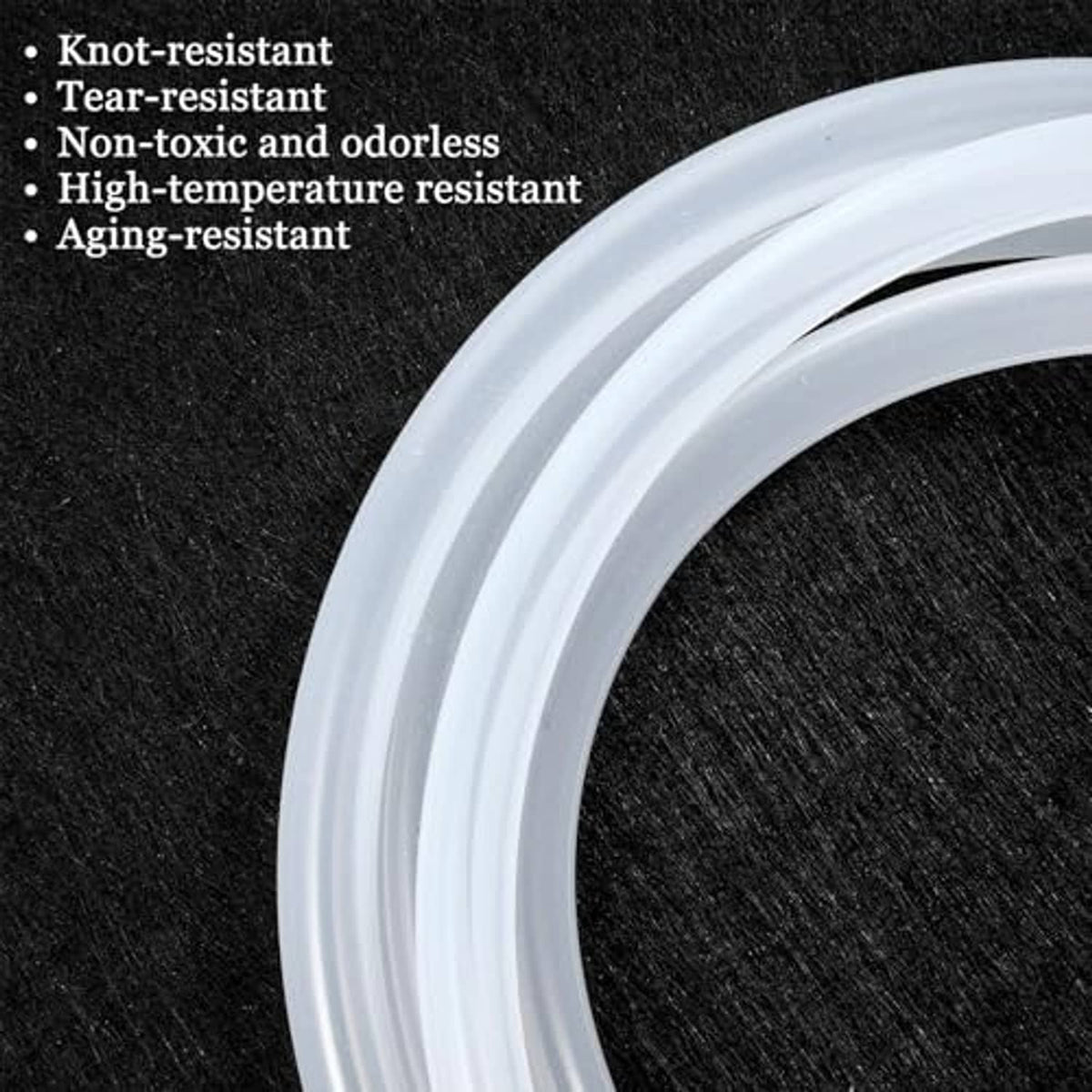 Coiled transparent silicone tubing close-up, uniform light-gray wall profile