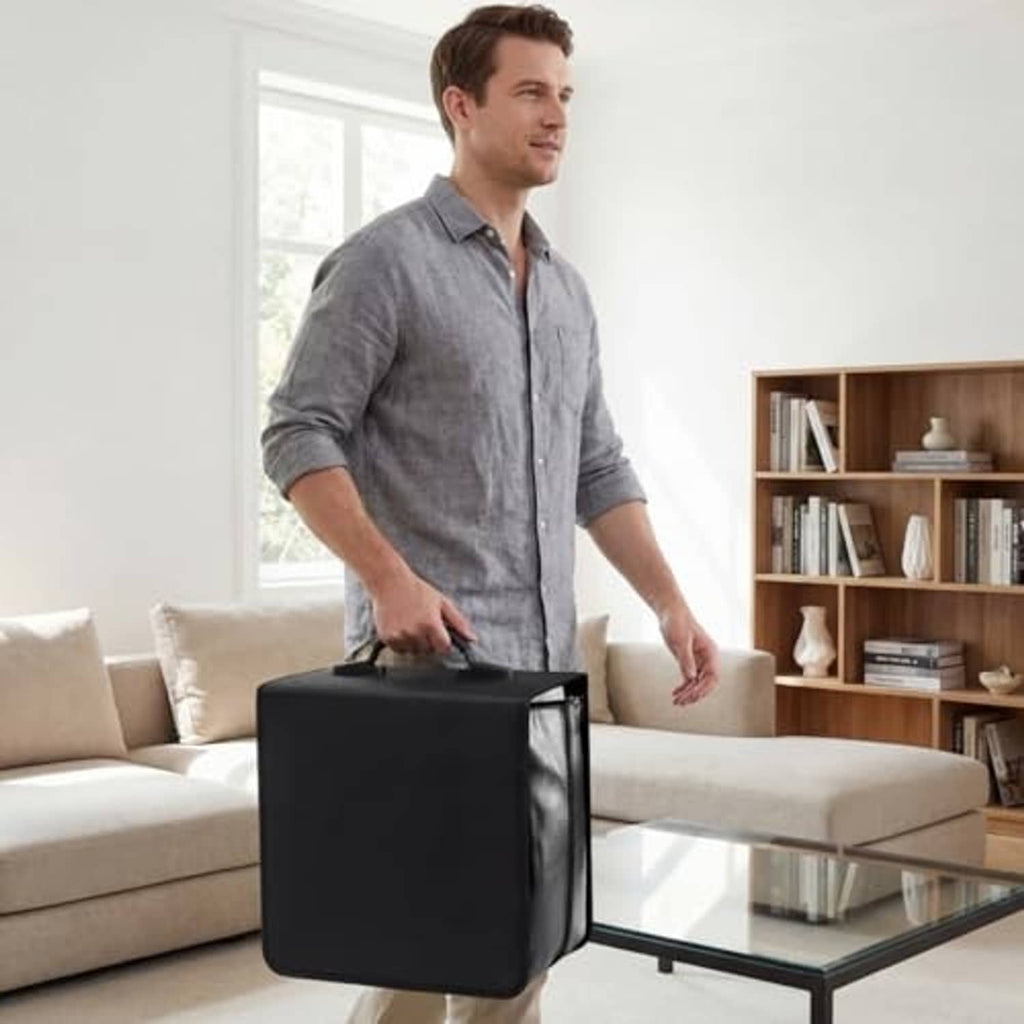 Black CD/DVD binder storage case with top handle and zipper, carried by person