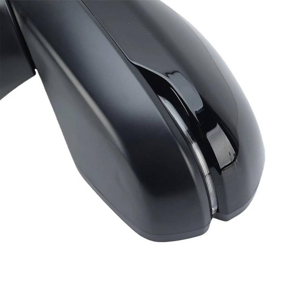 Side mirror housing close-up with integrated trim and reflective black finish