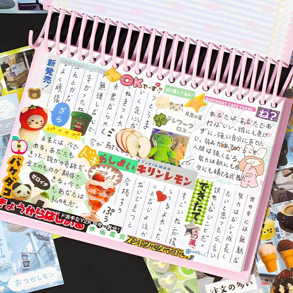 Pink spiral sticker book with colorful text stickers, animals, and food-themed graphics