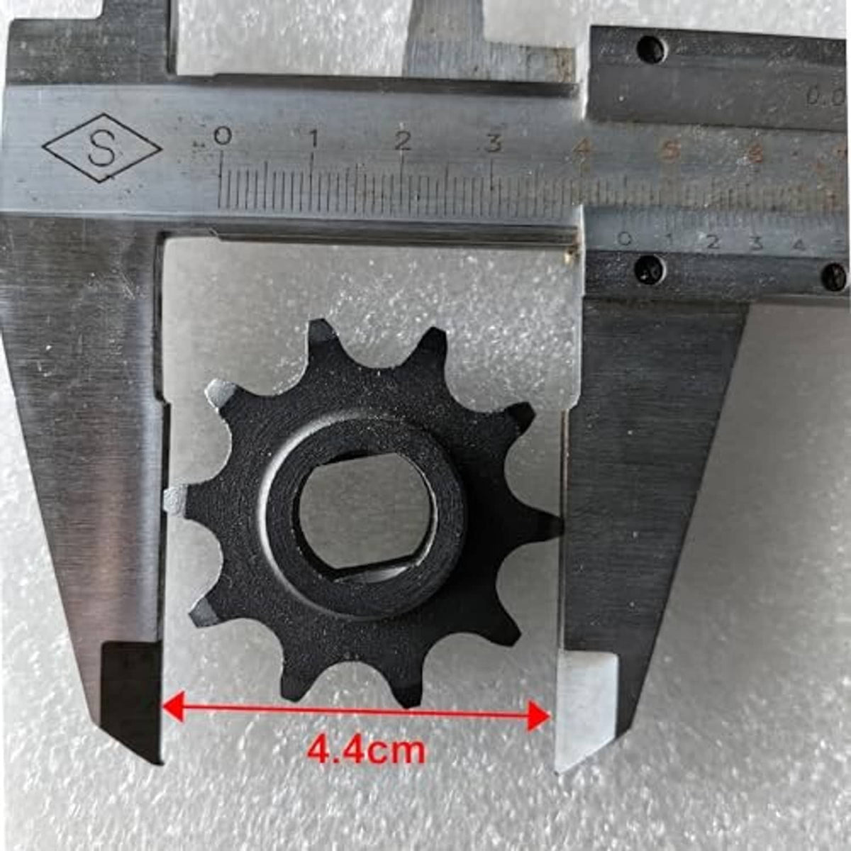 420 10T motor sprocket with center hole, measured 4.4 cm across