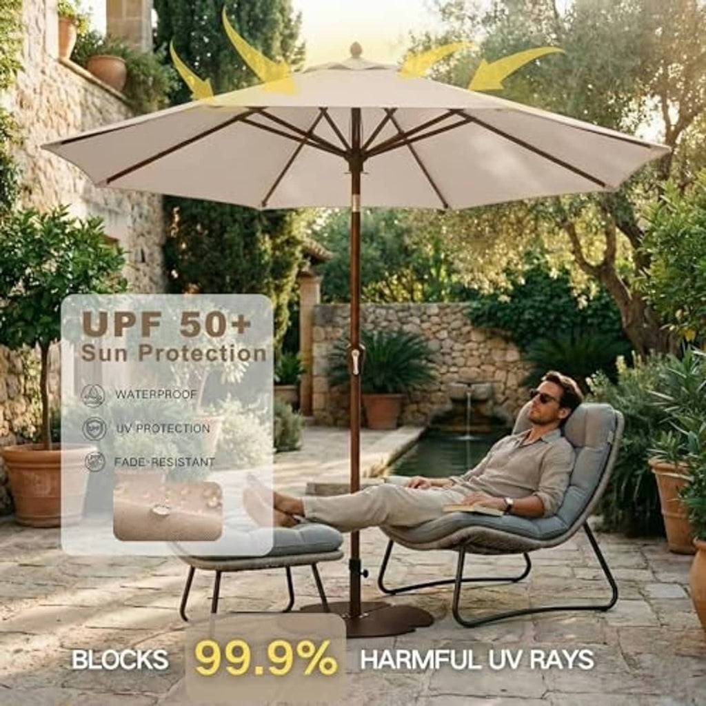 Beige patio umbrella with open round canopy on a dark pole in a garden