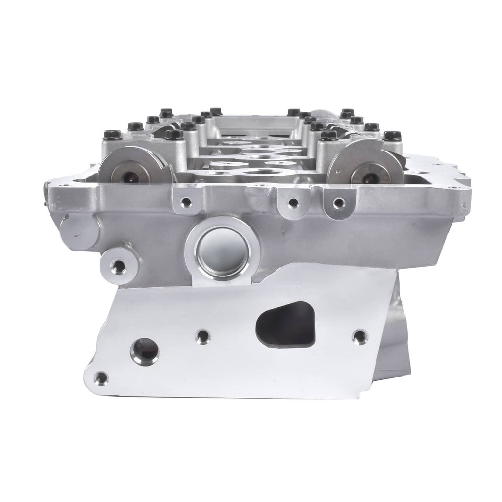 Aluminum cylinder head housing with bolt holes and machined openings for components.