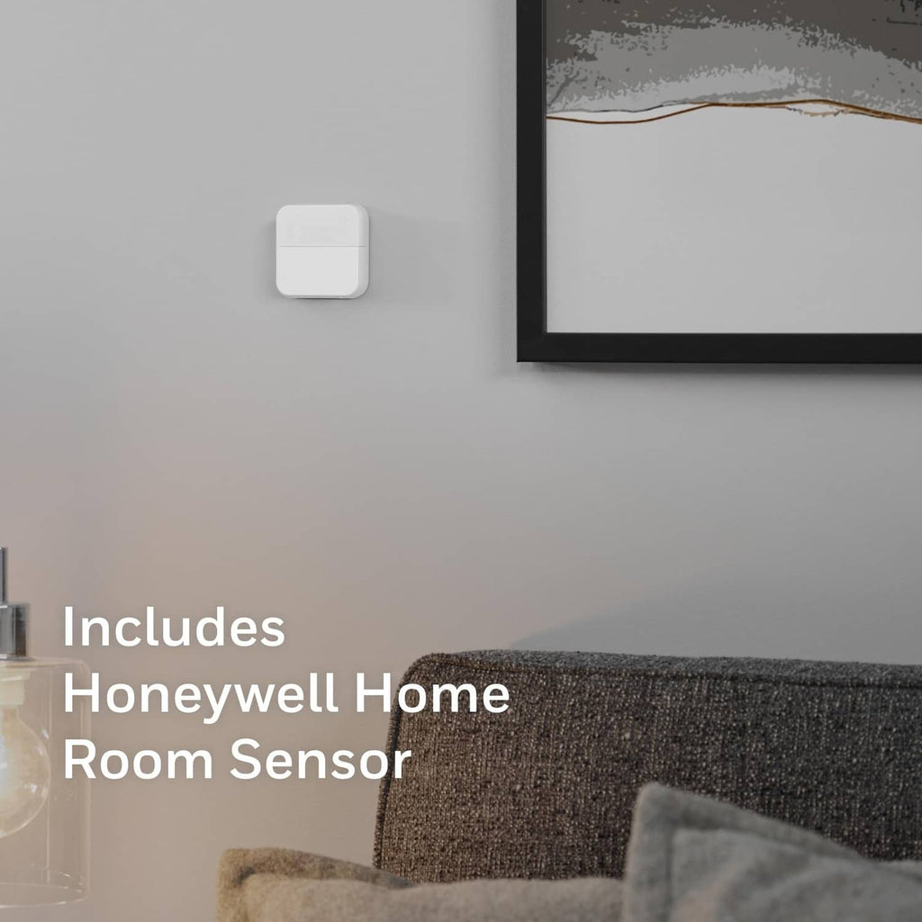 White Honeywell Home room sensor module on interior wall