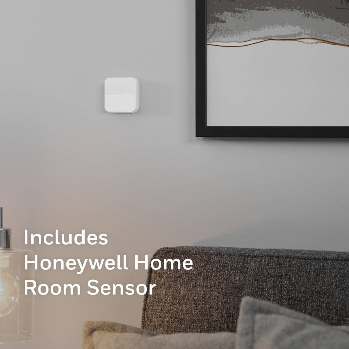 White Honeywell Home room sensor module on interior wall