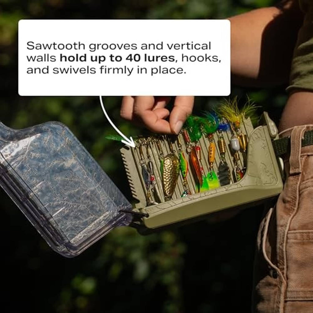 Open compact tackle storage box holding multiple lures in molded slots; clear lid.