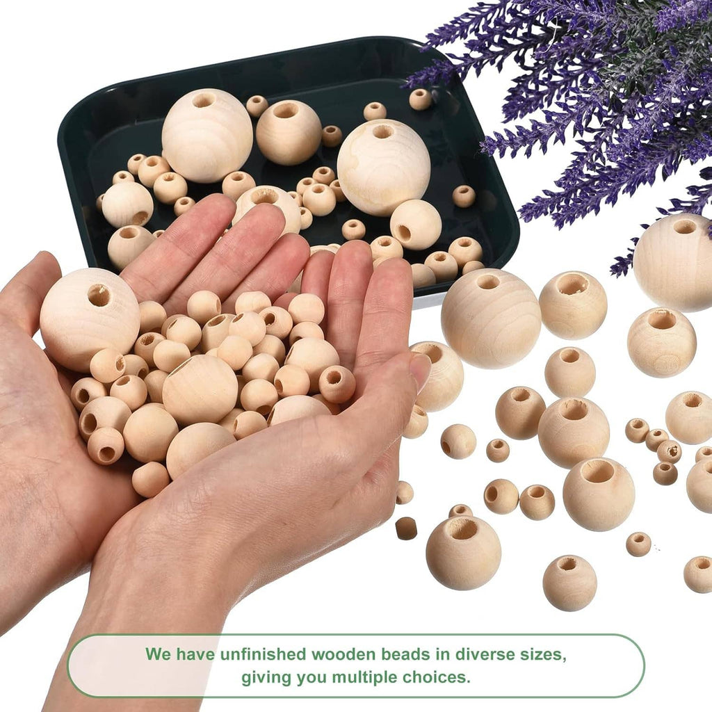 Hands holding unfinished natural wood round spacer beads with center holes