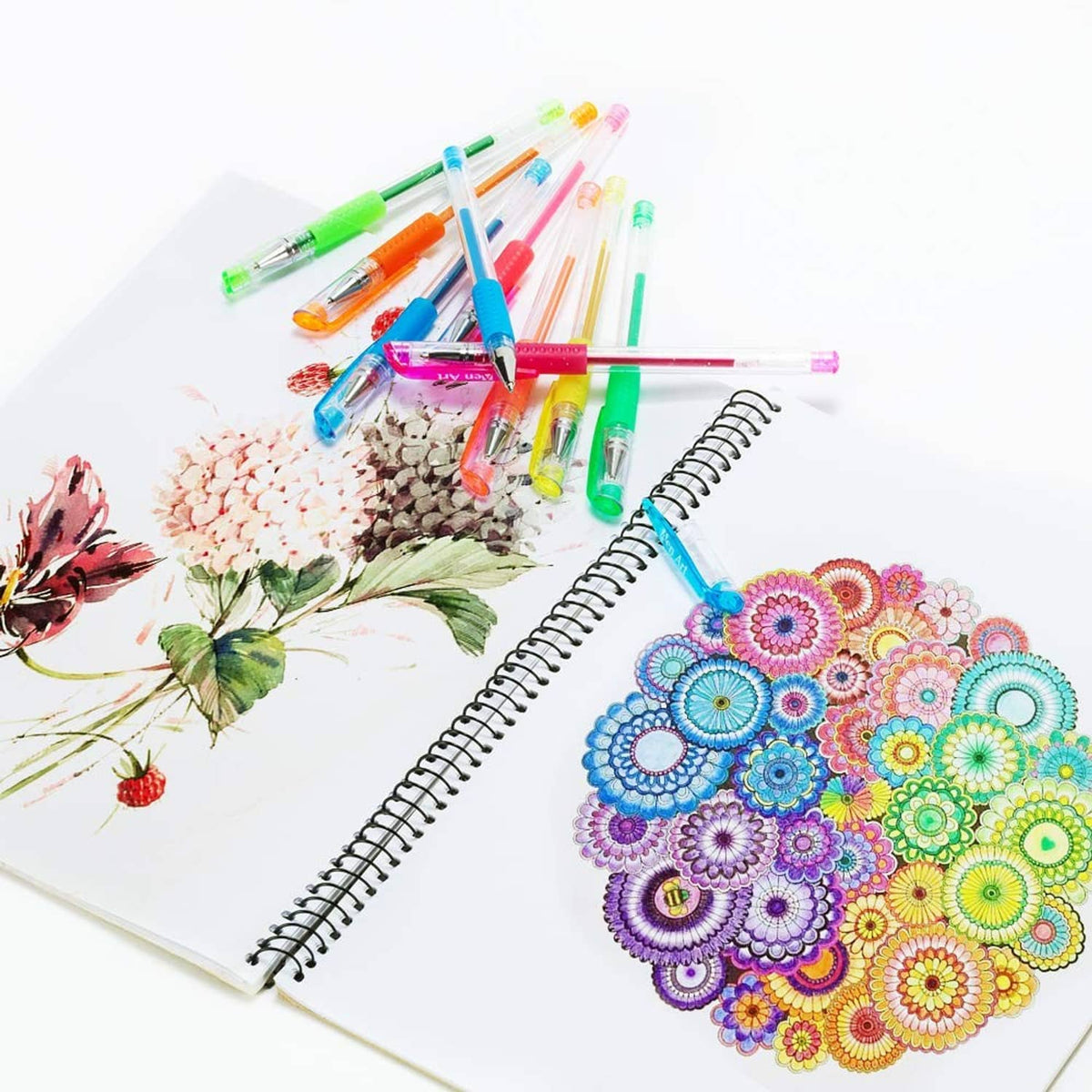 Gel pens scattered around a sketchbook page with colorful floral mandala