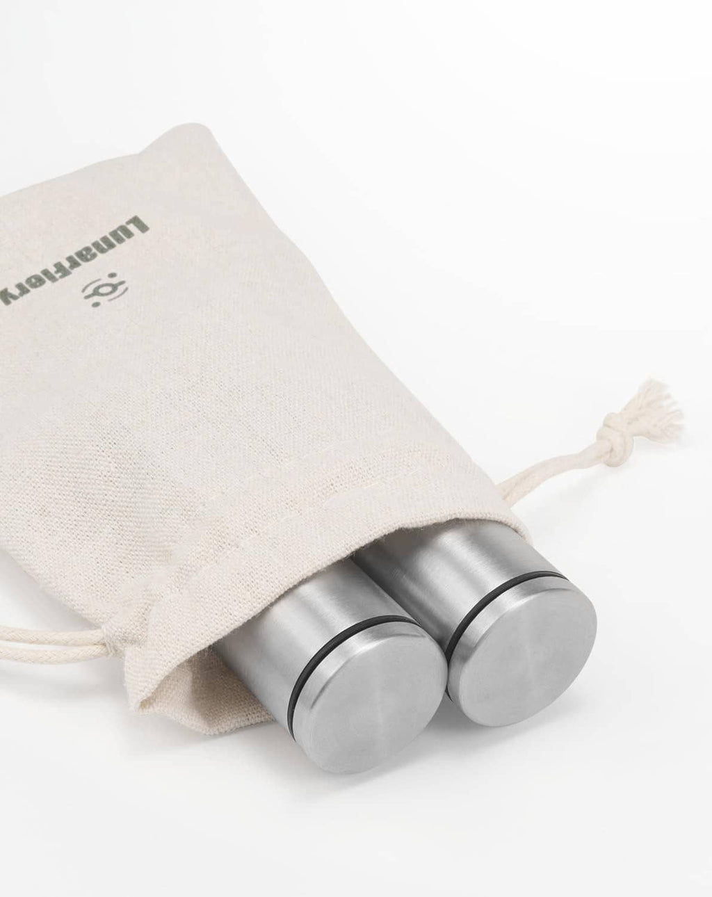 Drawstring storage pouch with stainless steel mini salt and pepper grinders laid on side