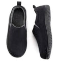 Black closed-back memory foam slippers with plush lining, slip-on faux suede upper.