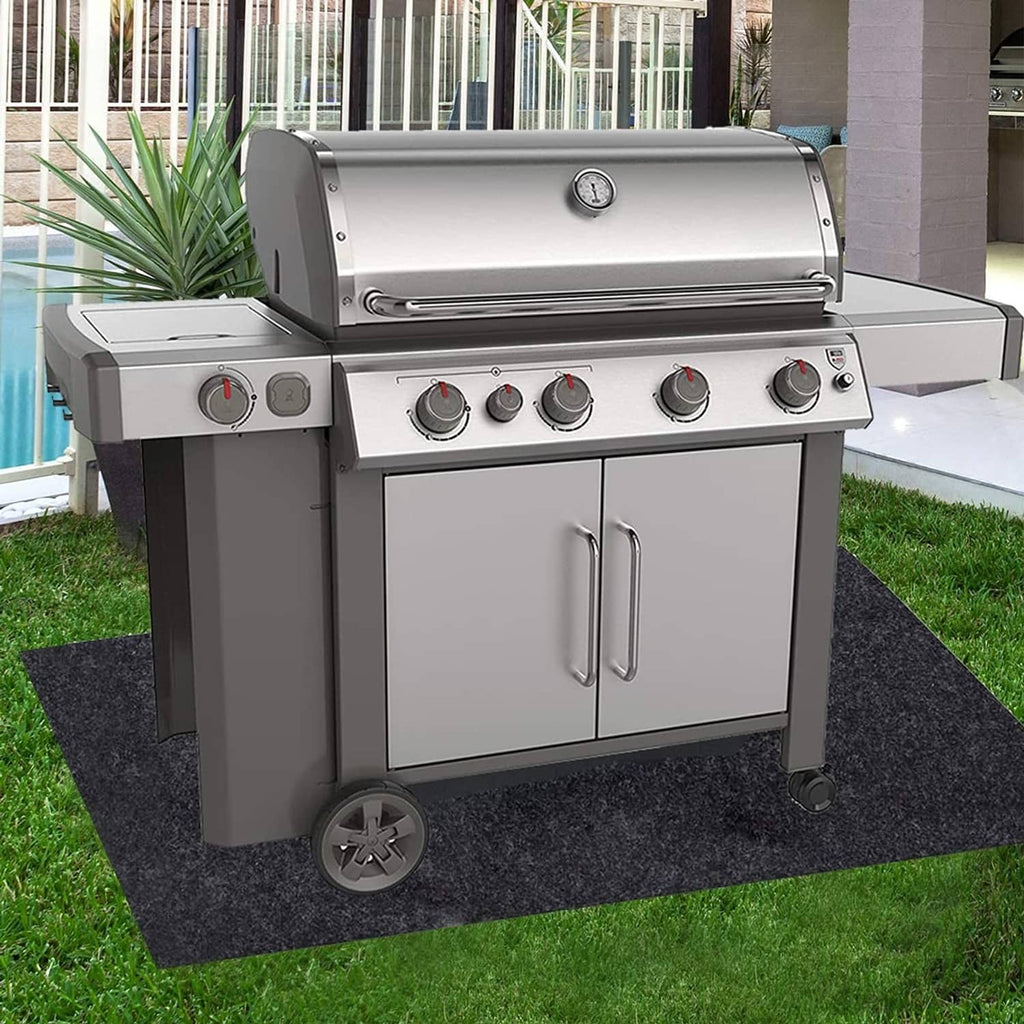 Grill mat under gas grill, dark charcoal gray rectangular absorbent sheet
