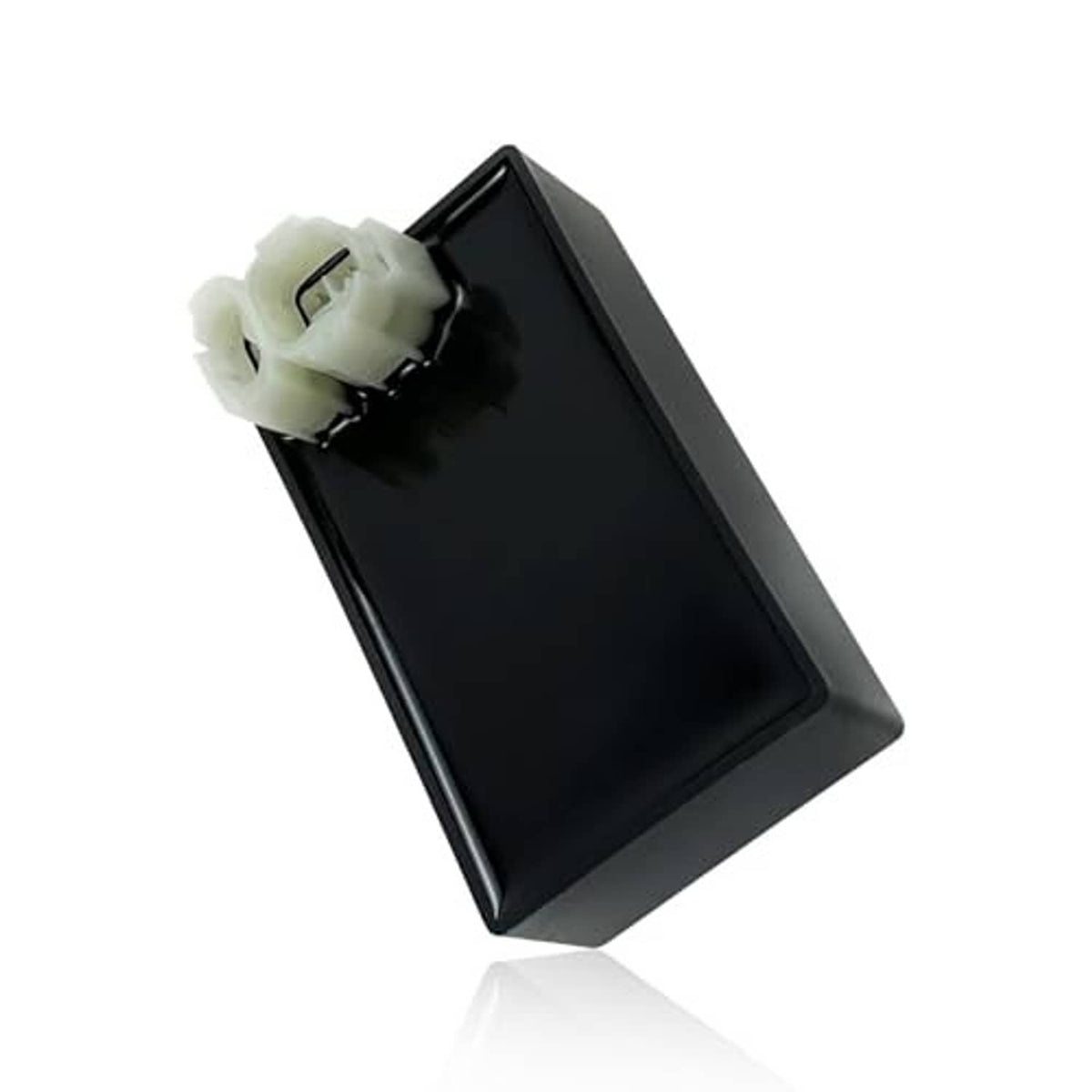 Black CDI module box with single white connector plug on mounting tab