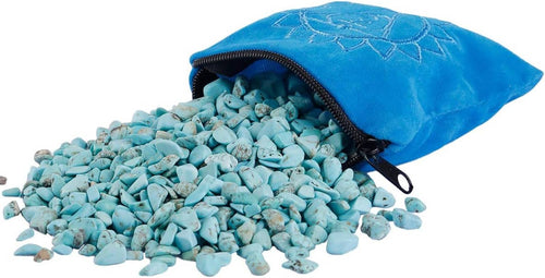 Turquoise howlite stone chips spilling from a blue zipper pouch with scattered fragments