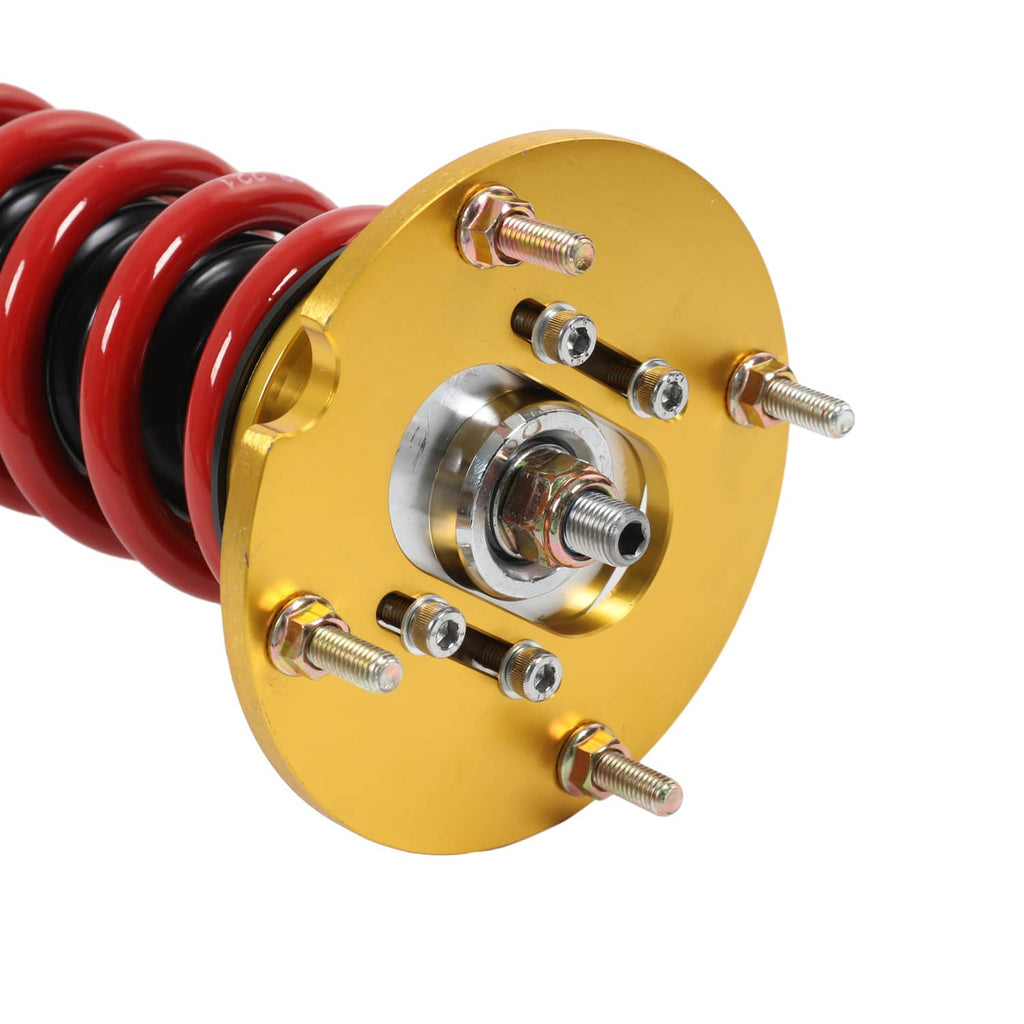 Gold coilover top mount plate with red coil spring and metal hardware
