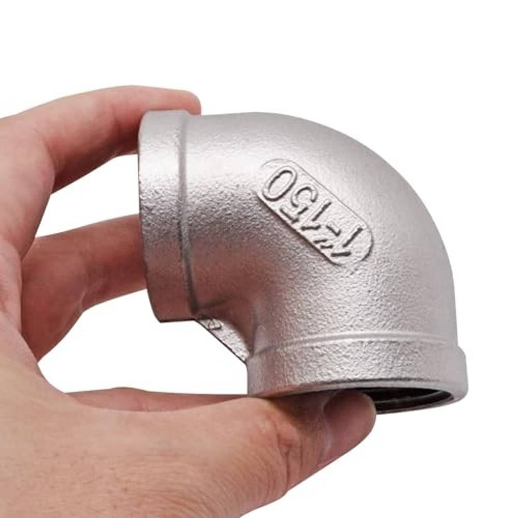 Hand holding stainless steel 90-degree street elbow with female NPT threaded end