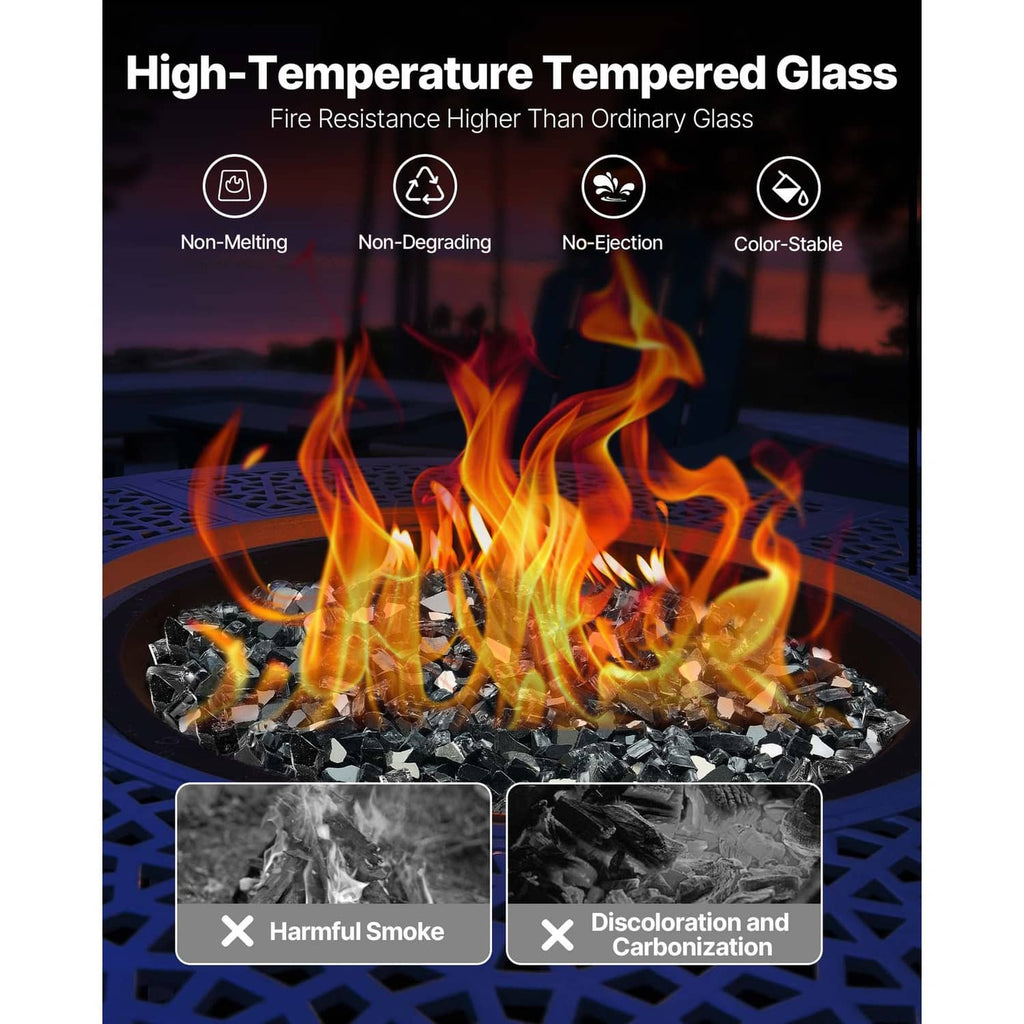 Crushed black fire pit glass rocks with tall flames in a fire bowl