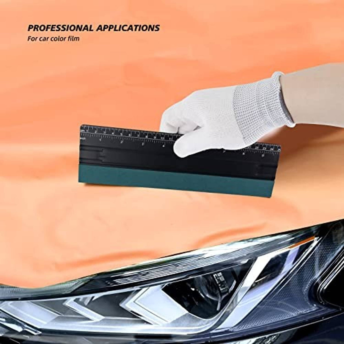 Large window tint squeegee with black blade and teal felt edge used by gloved hand