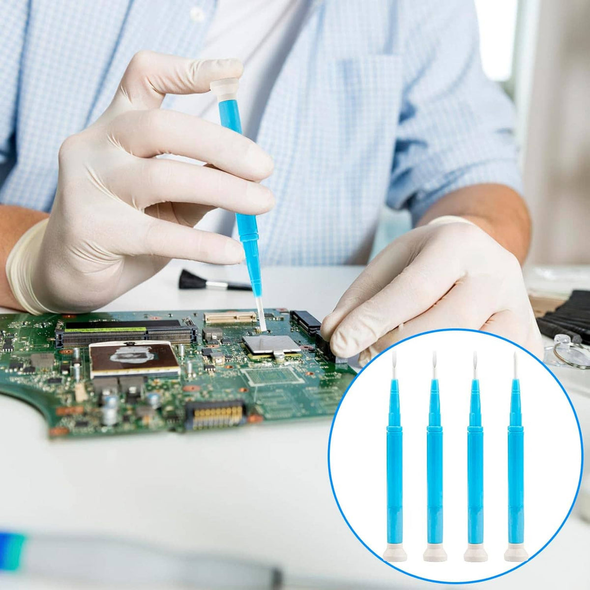 Gloved hands applying a blue slotted screwdriver to a computer circuit board