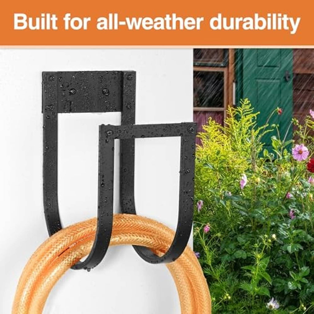 Black metal hose hanger with two hooks shown with water droplets for weatherproof use
