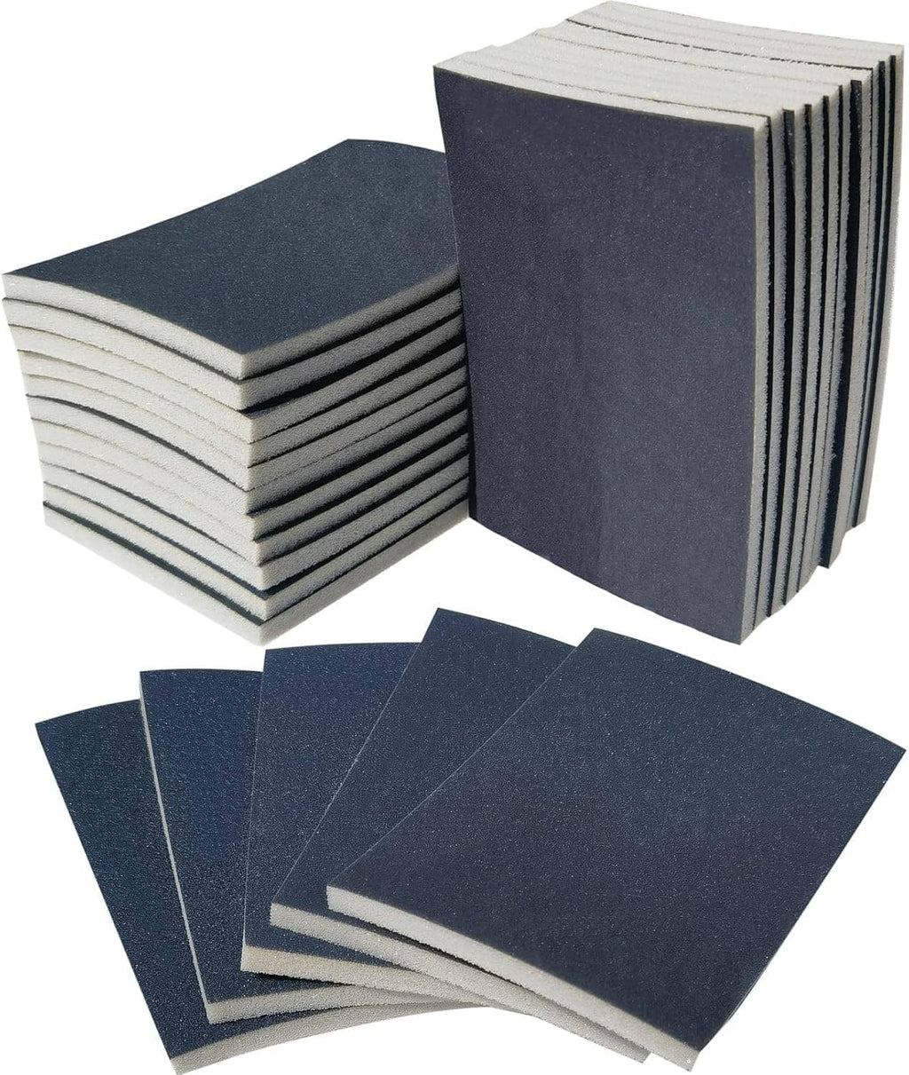Stacked dark blue-gray sanding sponge pads with sheets fanned in front
