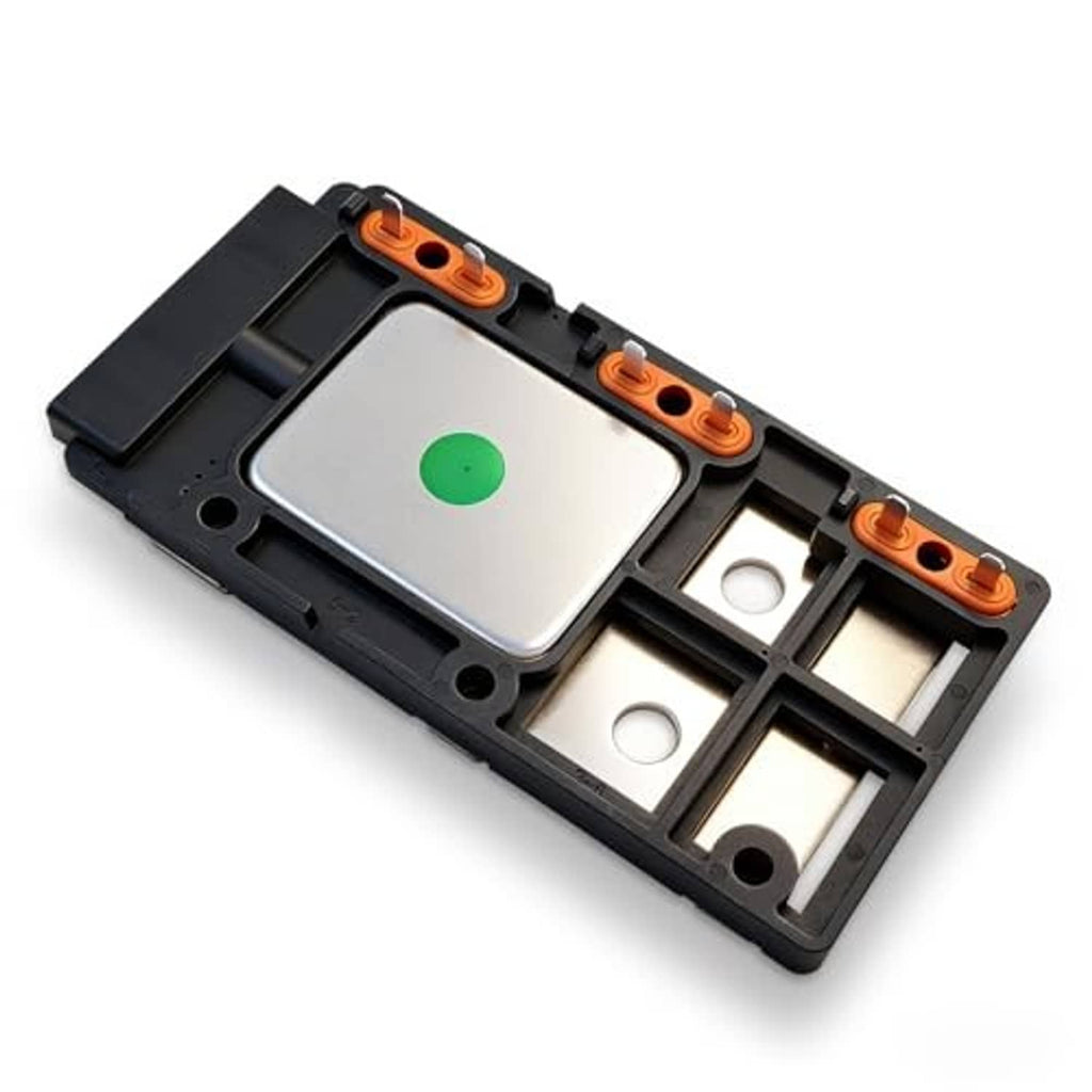 Engine ignition control module in black frame with silver cover and orange terminal blocks
