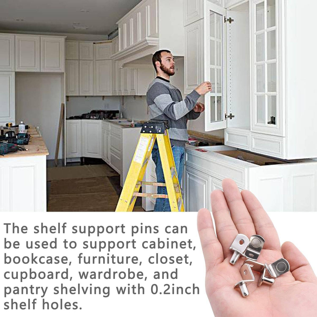 Hand holding silver shelf support pegs beside a built-in kitchen cabinet