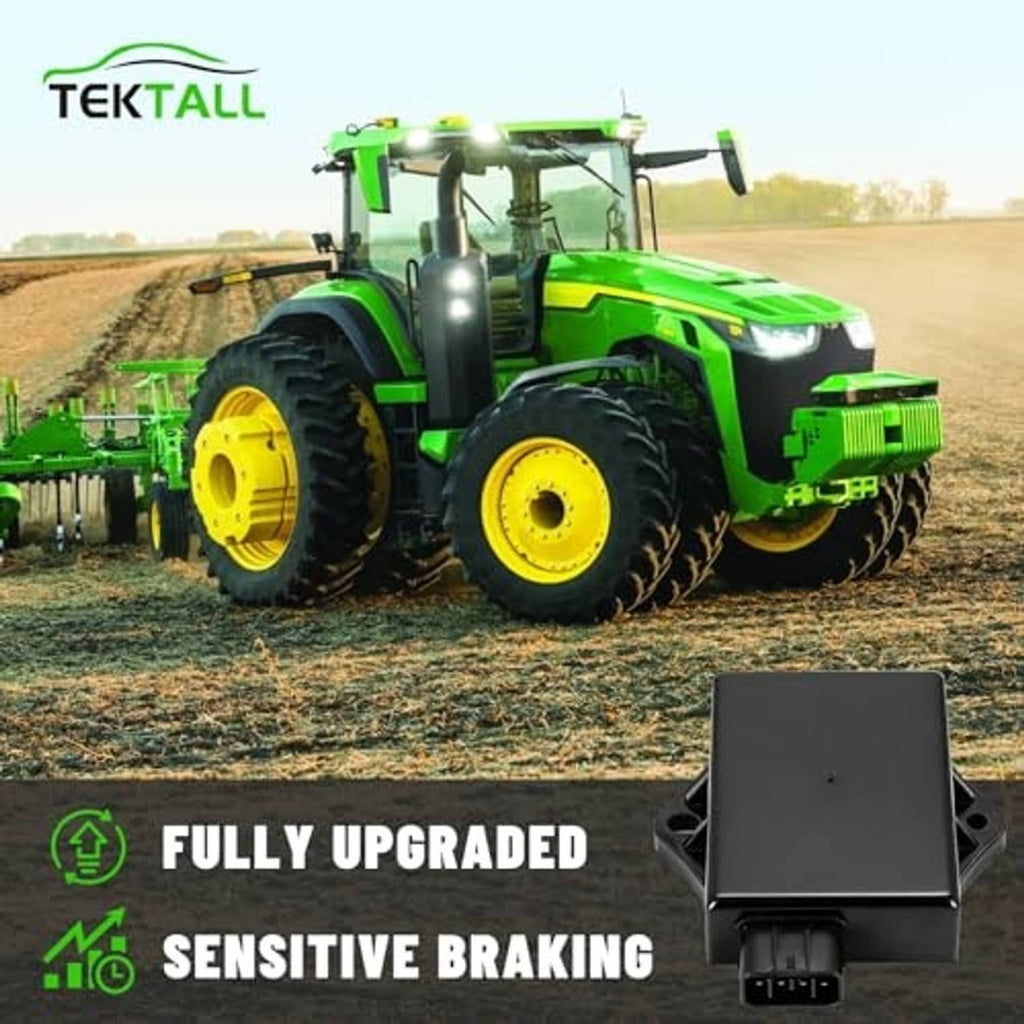 Black ignition CDI module shown with mounting bracket on a green tractor
