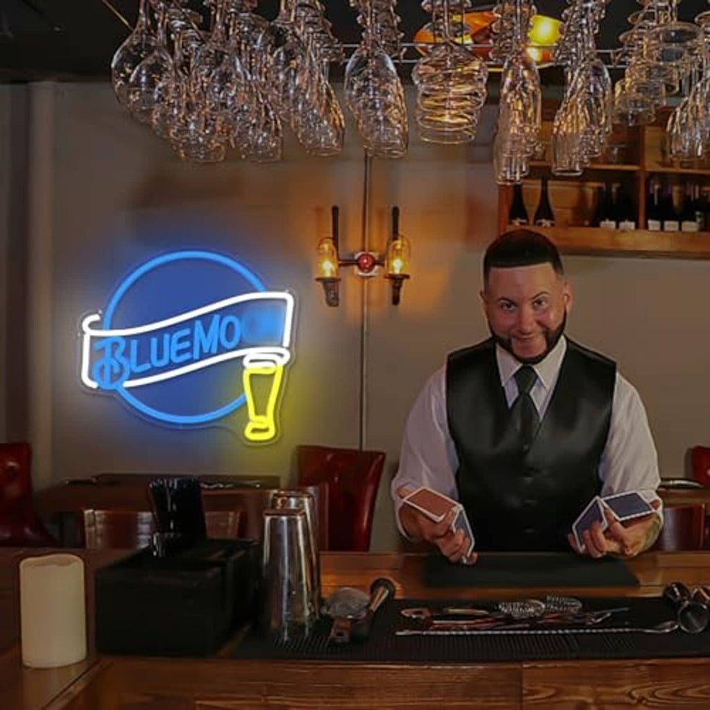 Neon beer wall sign glowing blue moon ring with BLUEMO text and yellow beer mug on bar