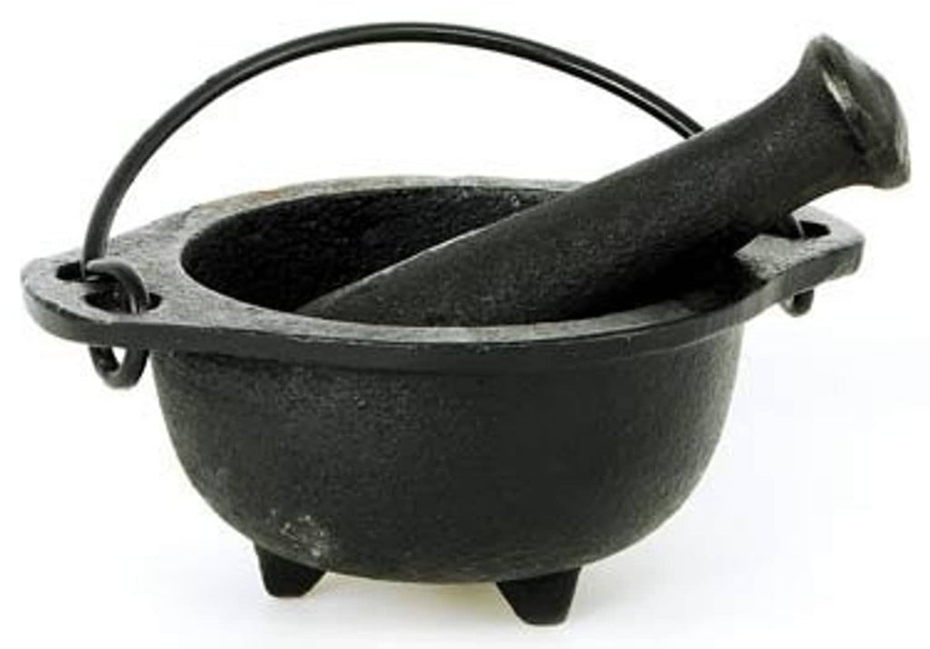 Black cast iron cauldron mortar with pestle, side view