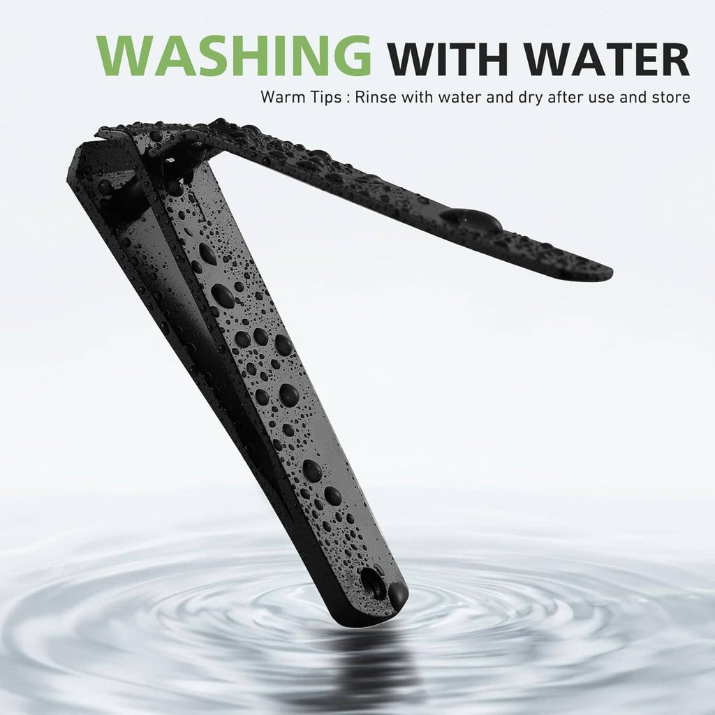 Black toenail clipper with water droplets, straight blade and top filing surface