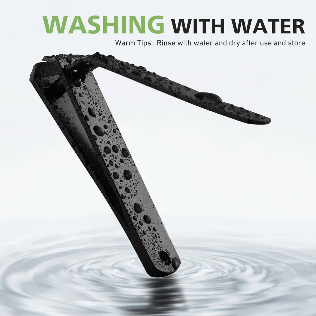 Black toenail clipper with water droplets, straight blade and top filing surface