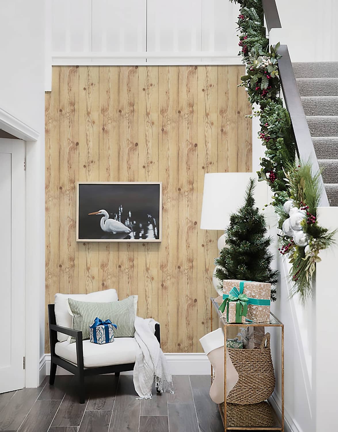 Wood plank wall covering in light tan with vertical grain lines and knot marks