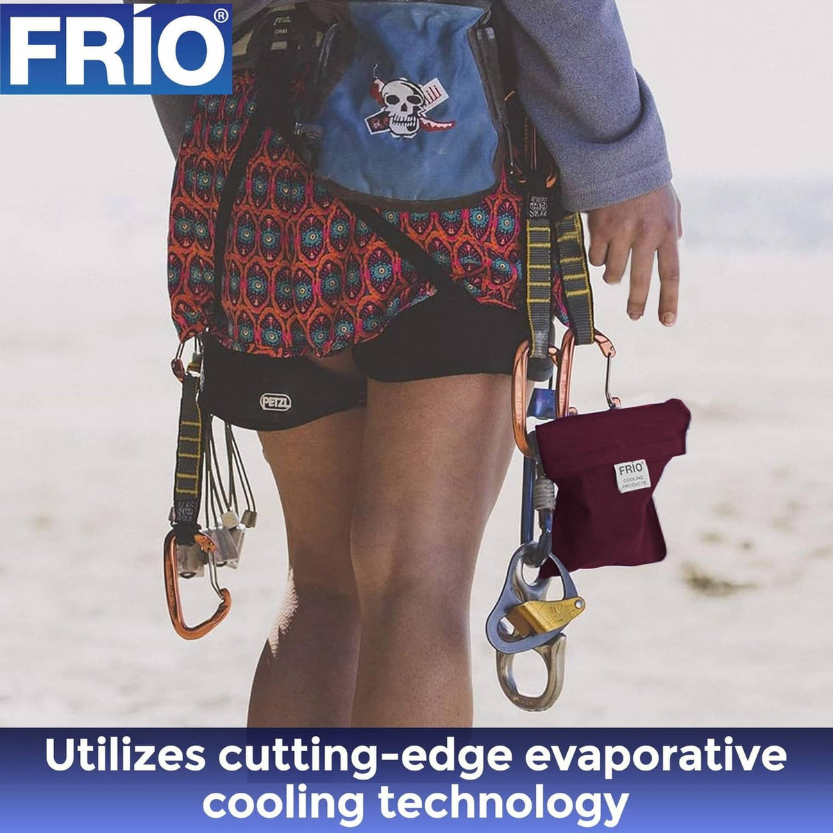 Burgundy FRIO cooling wallet with straps, held with insulin pens