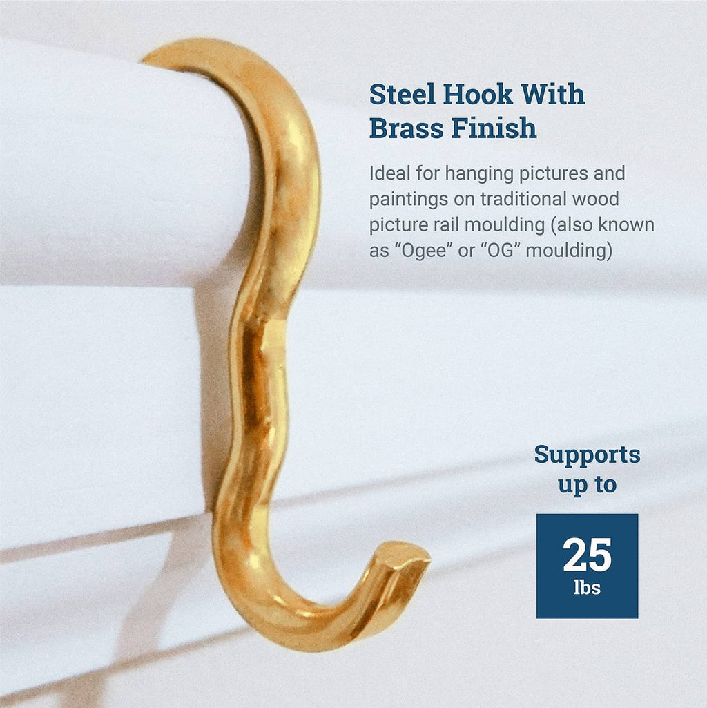Single brass-finish picture rail hook on molding, curved open end