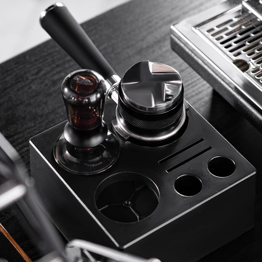 Black espresso tamper station base with fitted tamper and distributor tools