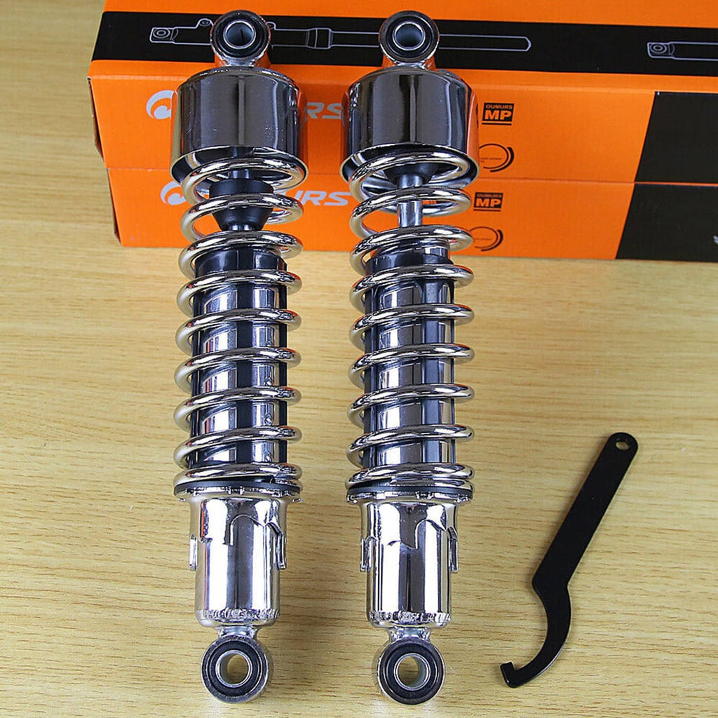Pair of chrome rear motorcycle shocks with coil springs and lower mounting bushings