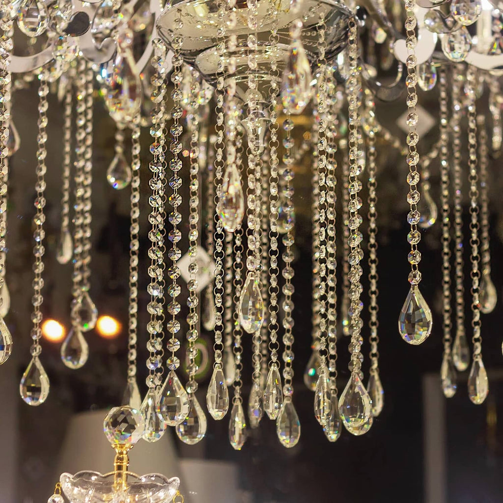 Clear teardrop crystal pendant beads with gold tone chains and hanging drops