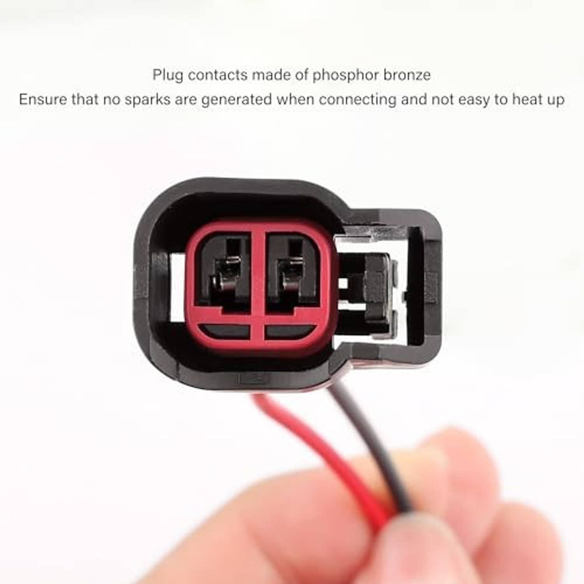 Close-up of fuel injector connector pigtail plug with red interior and black body