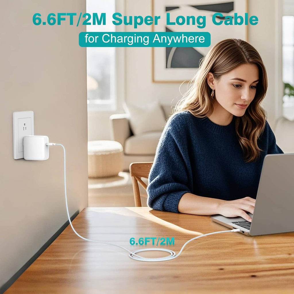 White USB-C charger with long 6.6 ft cable connected to a laptop