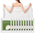 Disposable white bath towels draped over shoulders, soft fabric, ready to use