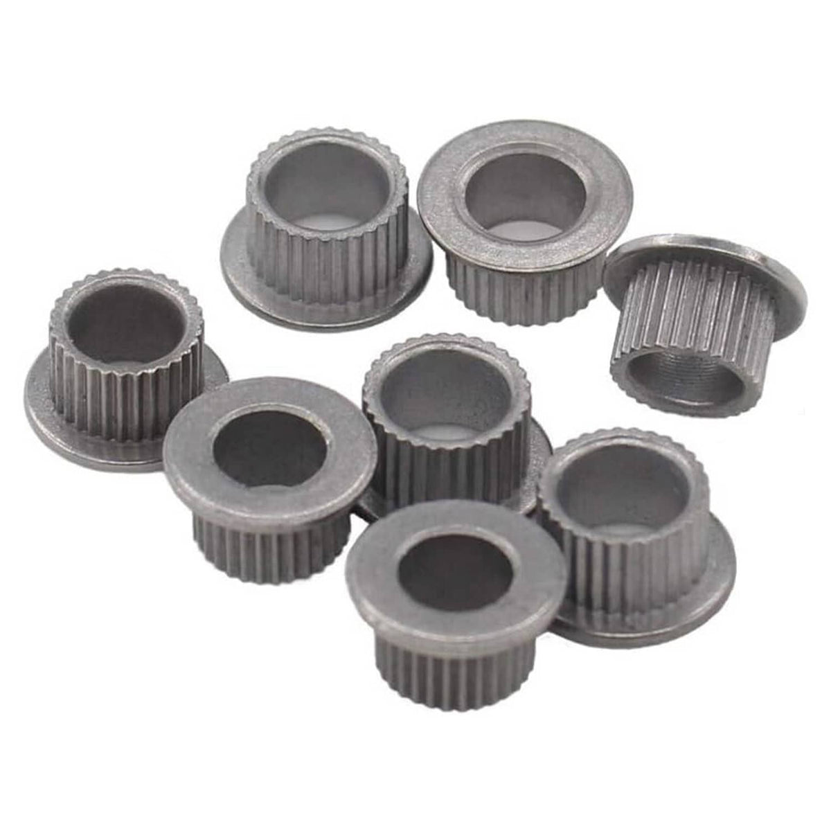 Door hinge pin bushing repair kit includes gray grooved bushings with central openings