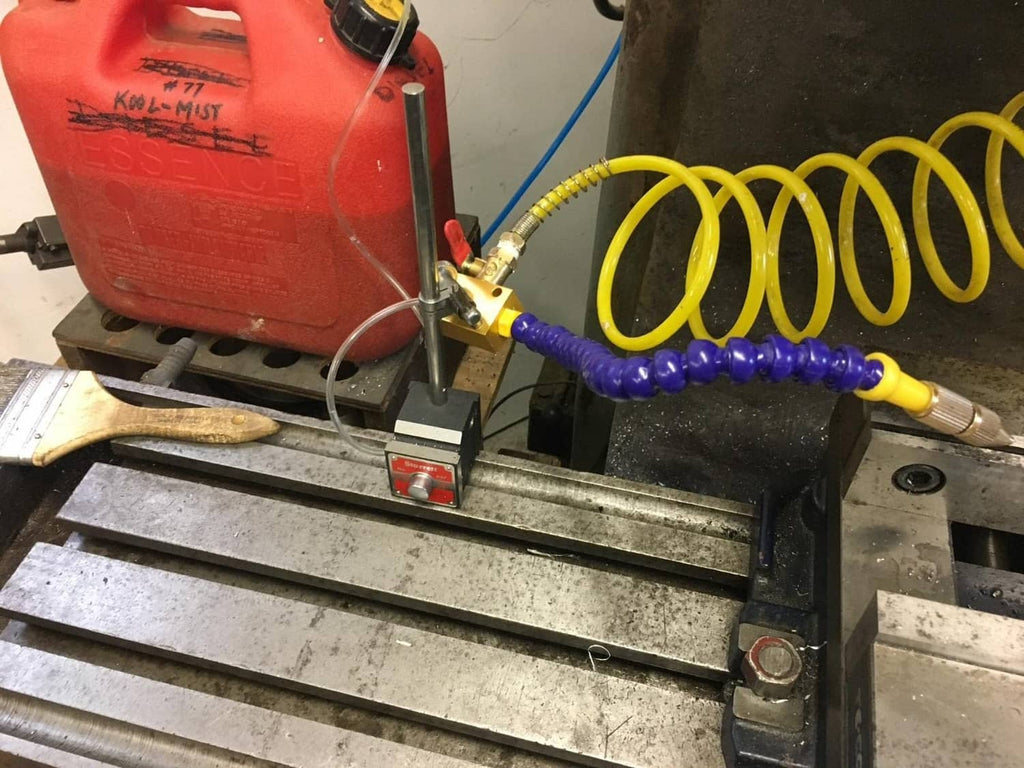 CNC mist coolant spray system connected to an air setup on a machine