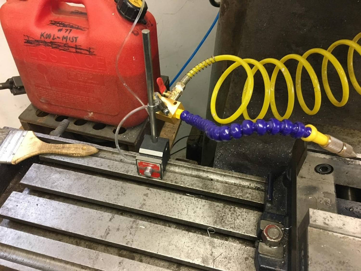 CNC mist coolant spray system connected to an air setup on a machine