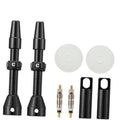 Black Presta tubeless valve stems set with caps and cores, plus black protective sleeves