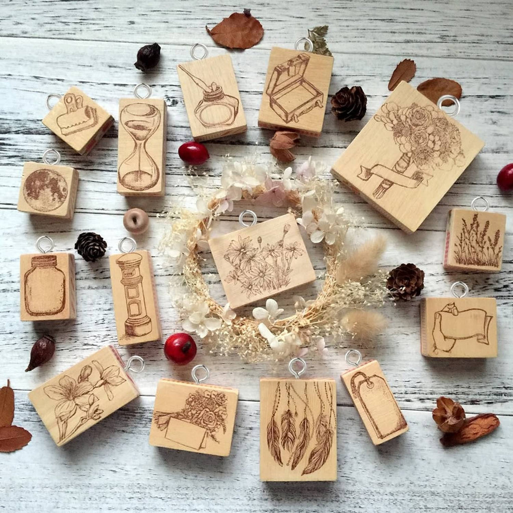 Wooden hang tags with printed designs, each with a small metal loop for attaching strings