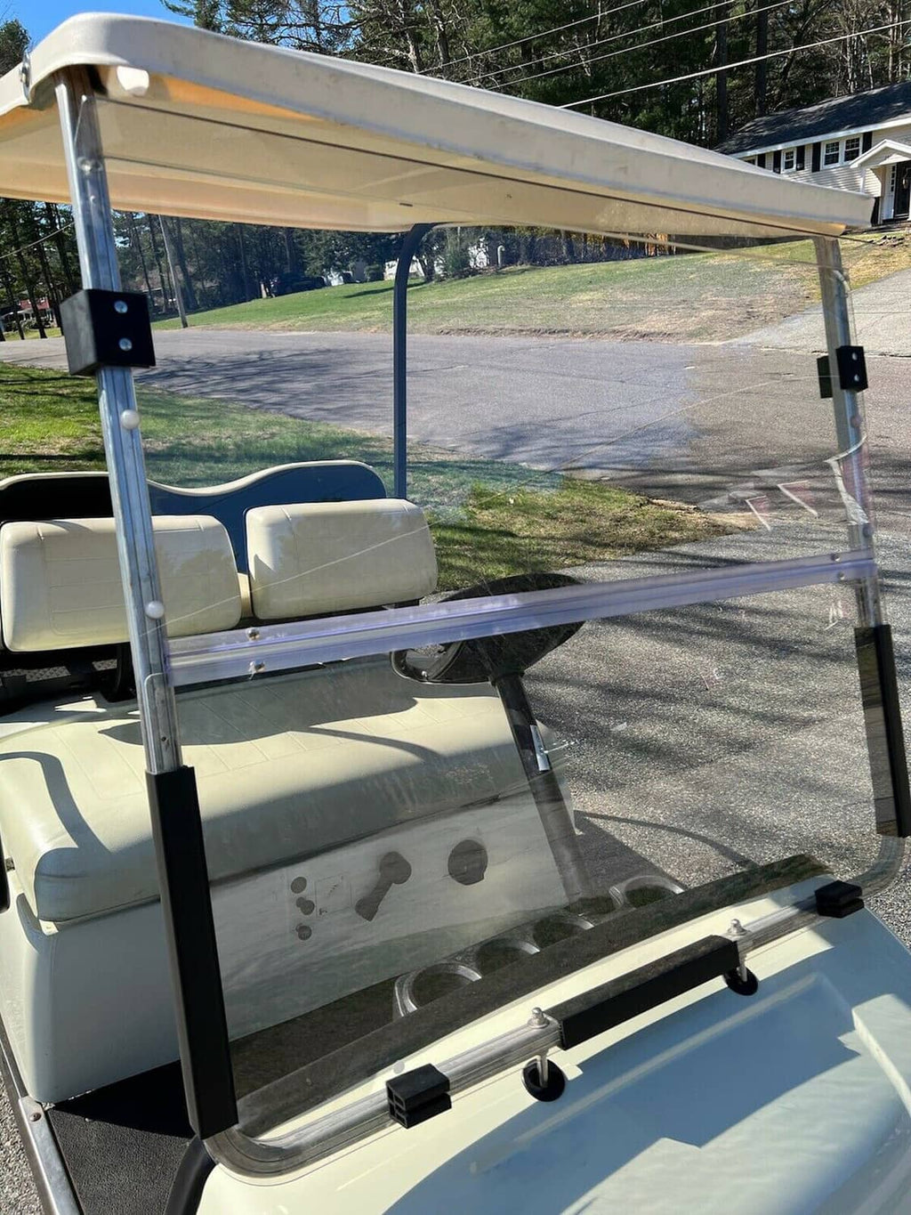 Clear folding windshield with metal frame and clear panel for golf cart