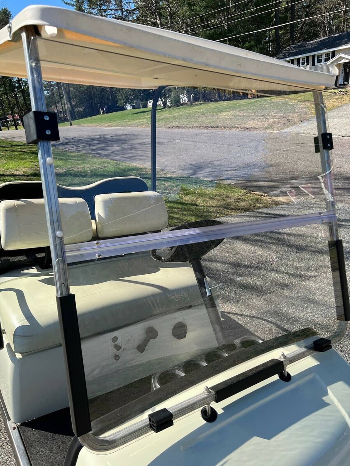 Clear folding windshield with metal frame and clear panel for golf cart