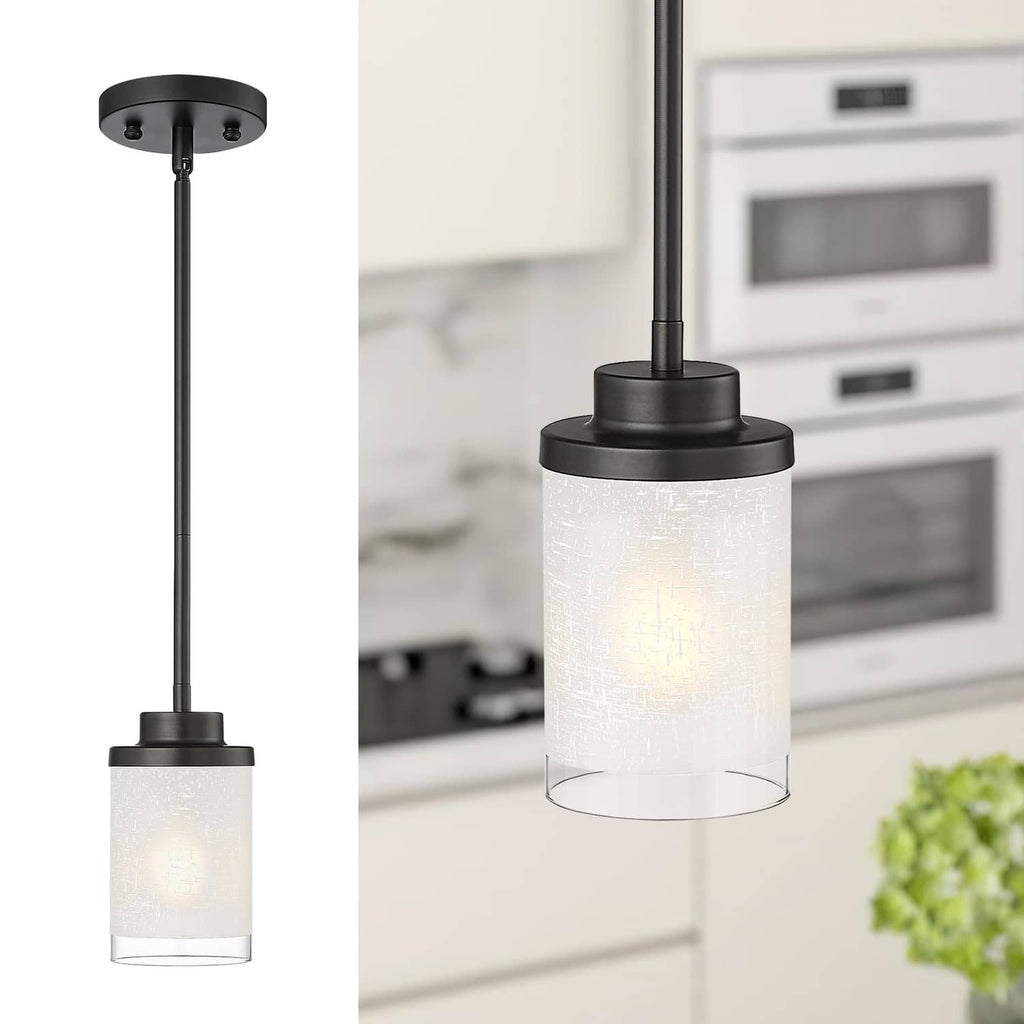 Matte black pendant light with frosted glass cylinder shade and flat top mounting plate.