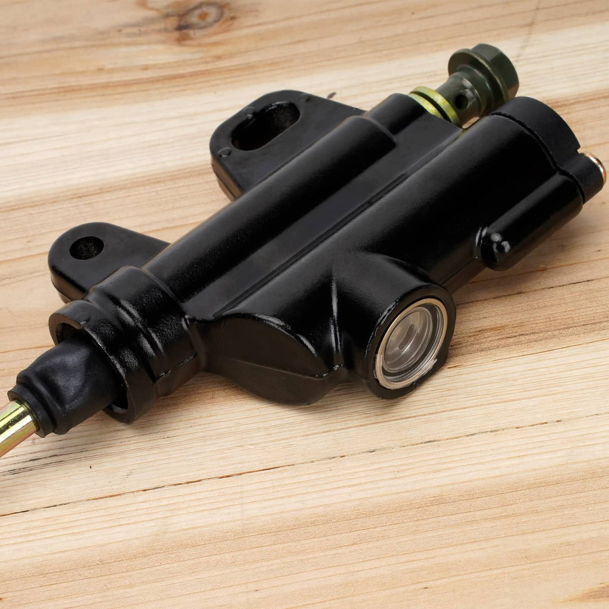 Black rear brake master cylinder with circular reservoir and mounting holes