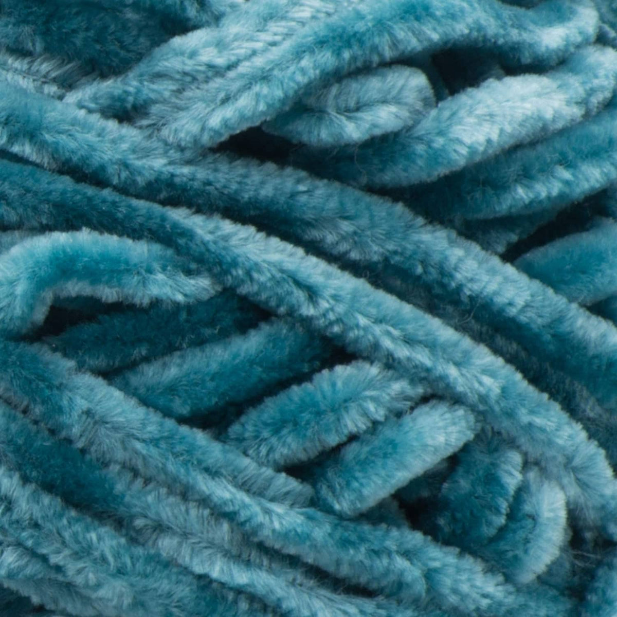 Close-up of teal-blue fuzzy chenille yarn loops with plush velvet-like pile